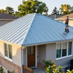 Steel roofing Ontario installation process with homeowner discussing benefits with professional roofer.